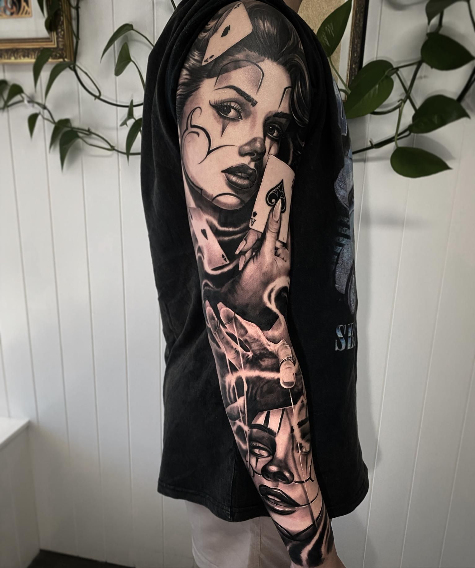 A Man Has a Tattoo of a Woman on His Arm — Gallery Tattoo in Medowie, NSW