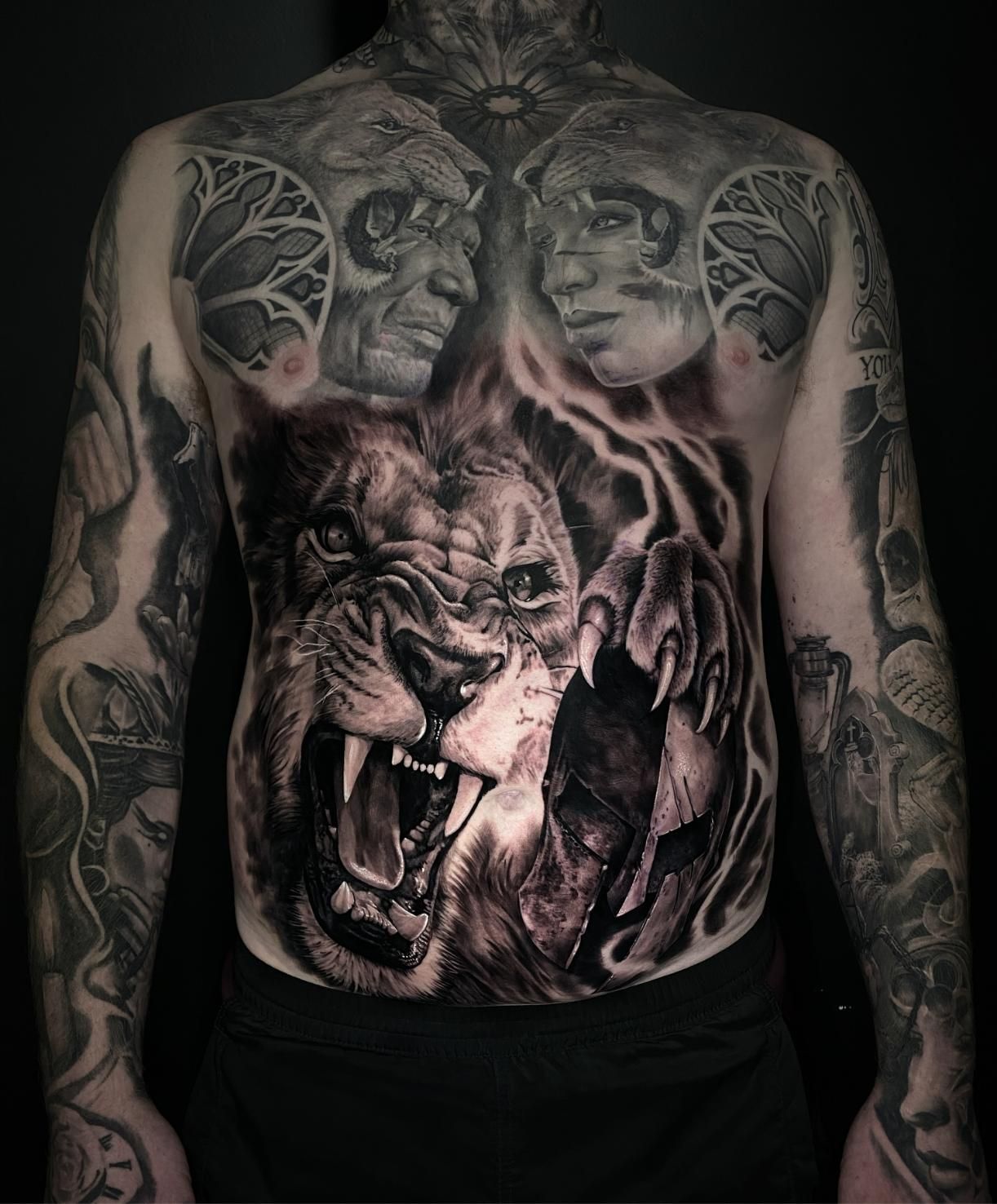 A Man Has a Tattoo of a Lion on His Stomach — Gallery Tattoo in Medowie, NSW
