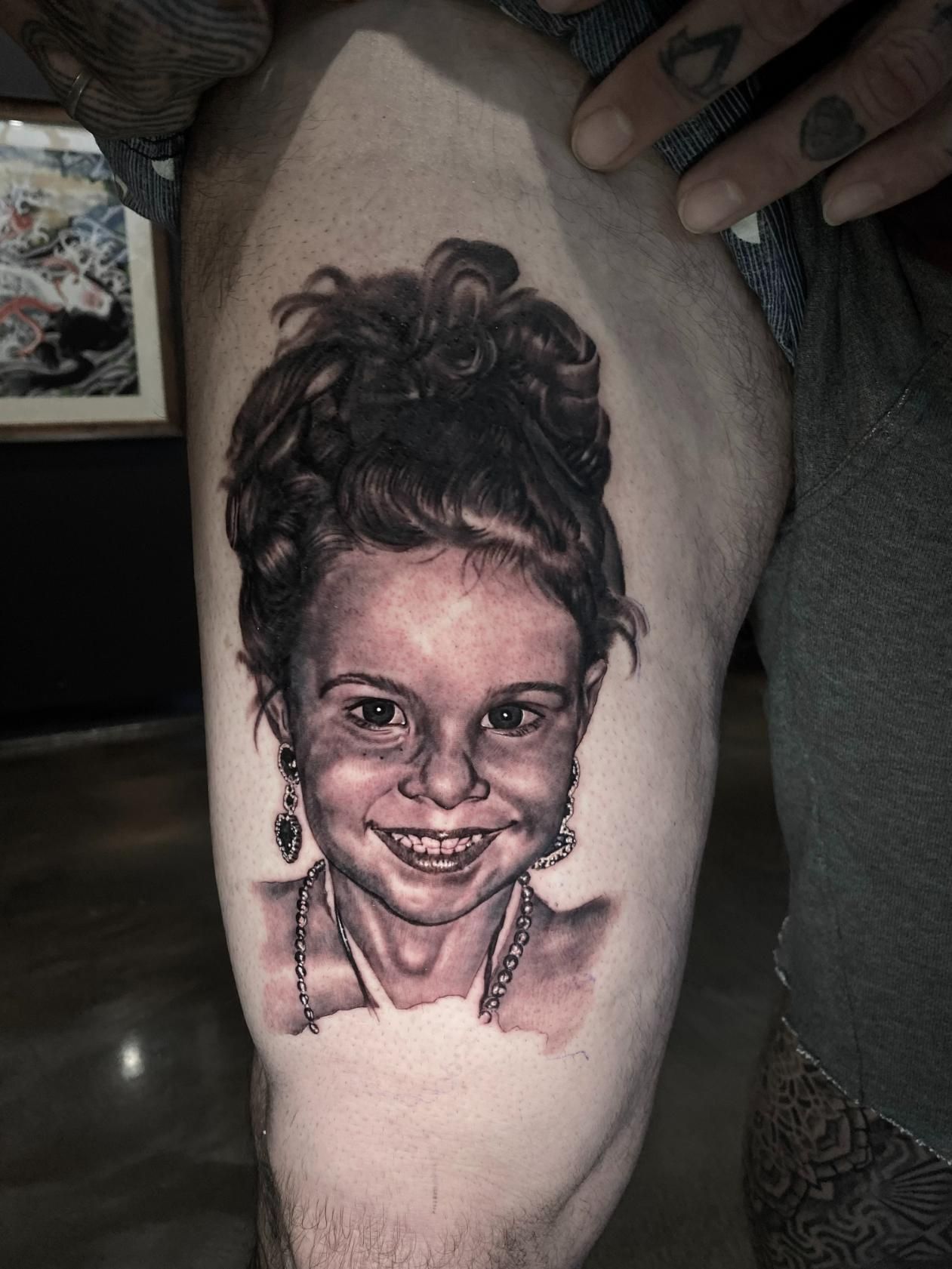 A Man Has a Tattoo of a Little Girl on His Leg — Gallery Tattoo in Medowie, NSW