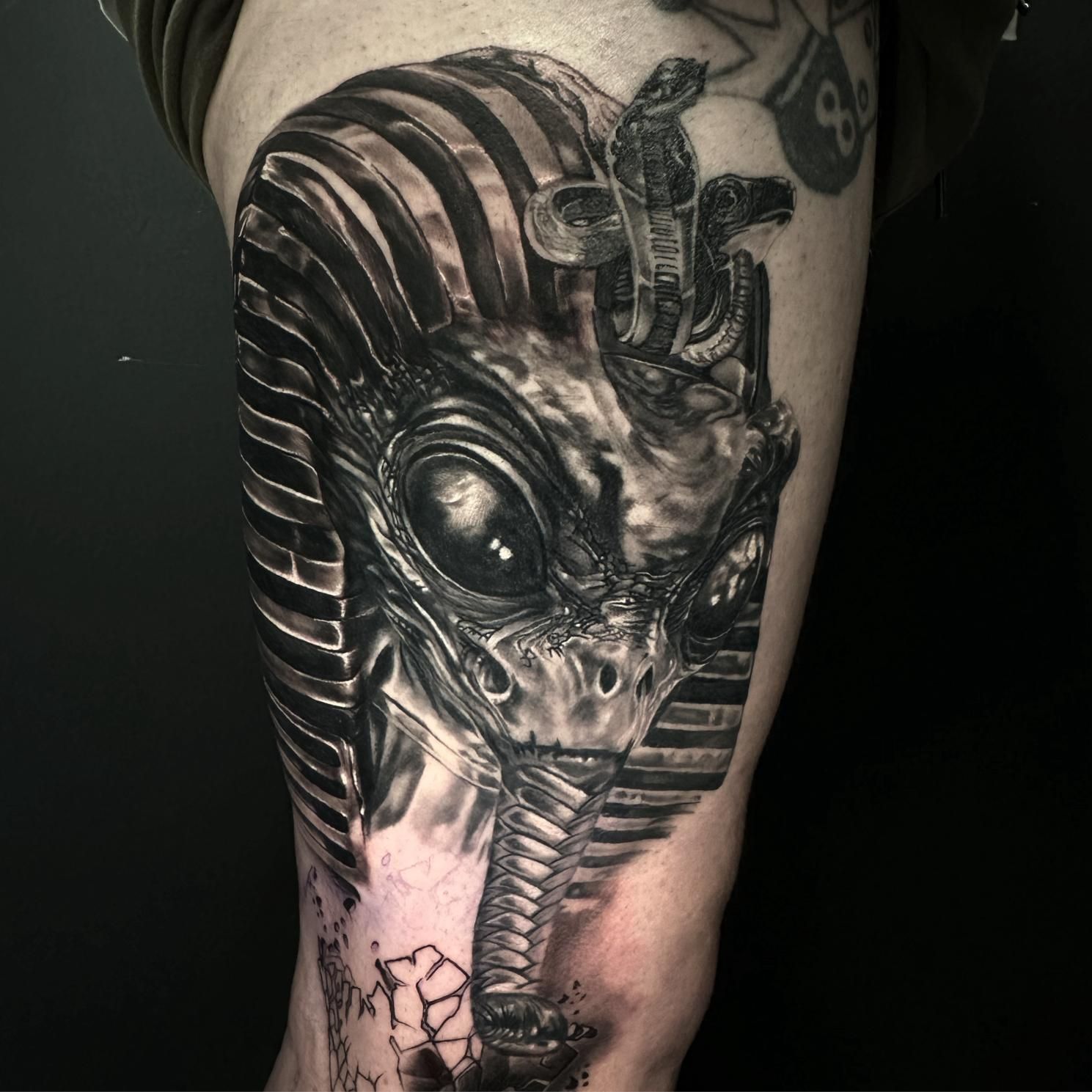 A Black and White Tattoo of a Pharaoh on a Person 's Leg — Gallery Tattoo in Medowie, NSW