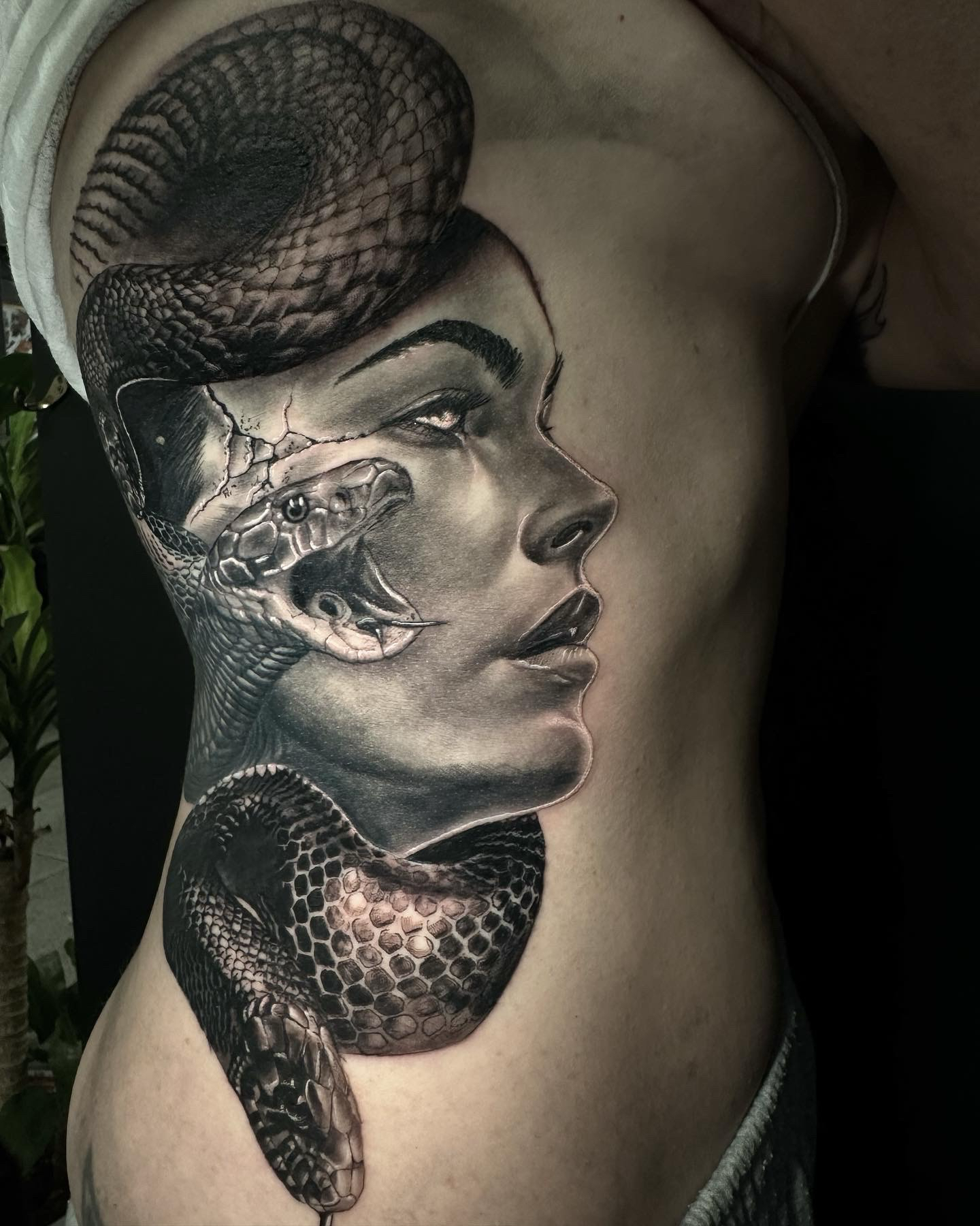 Tattoo Of Woman And Snake On Ribs — Gallery Tattoo in Medowie, NSW