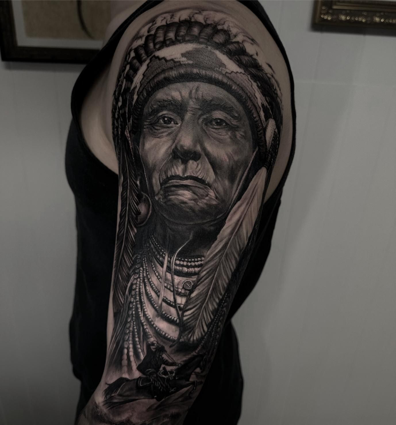 A Man Has a Tattoo of an Indian Chief on His Arm — Gallery Tattoo in Medowie, NSW
