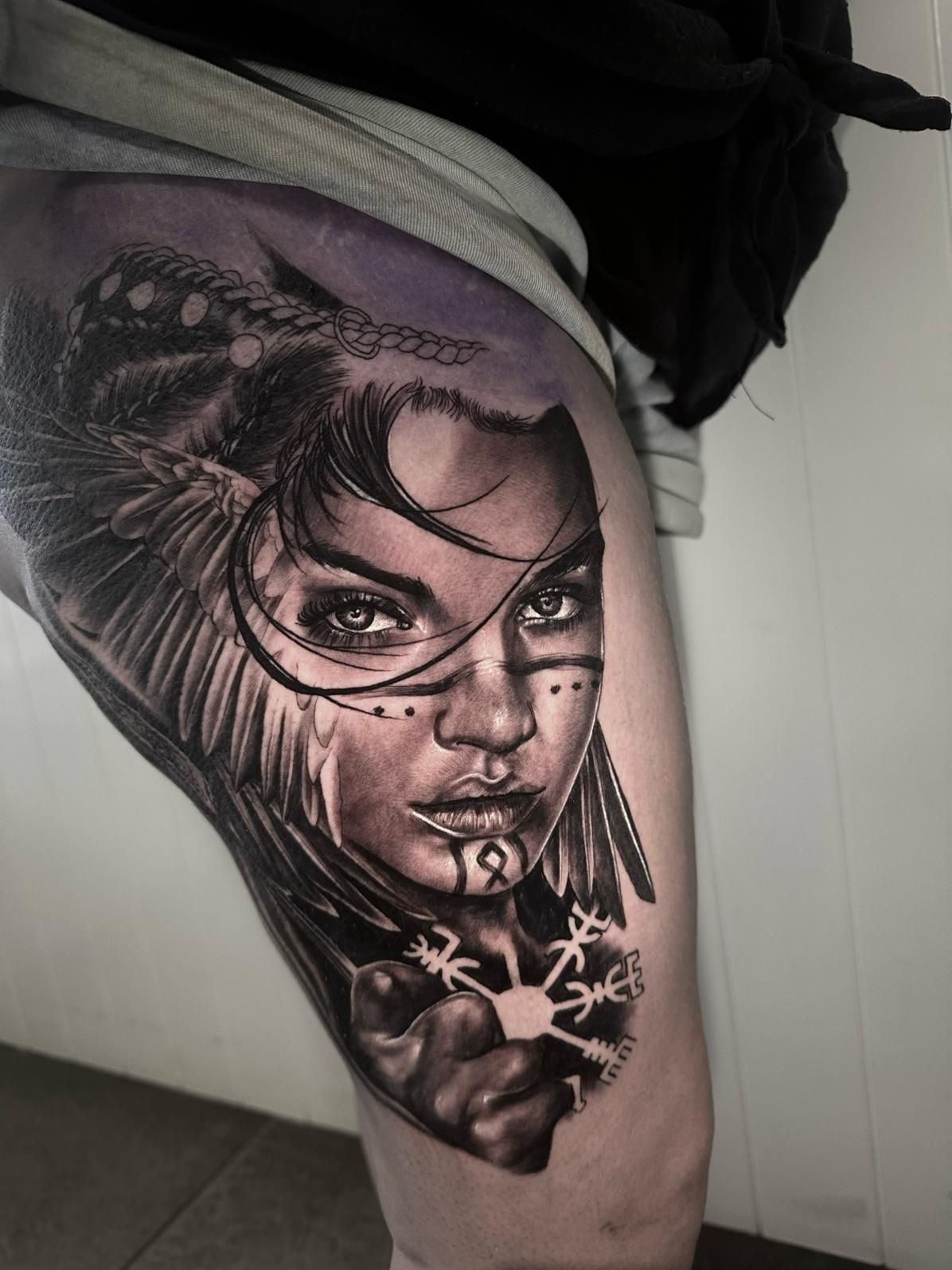 A Woman Has a Tattoo of a Native American on Her Leg — Gallery Tattoo in Medowie, NSW
