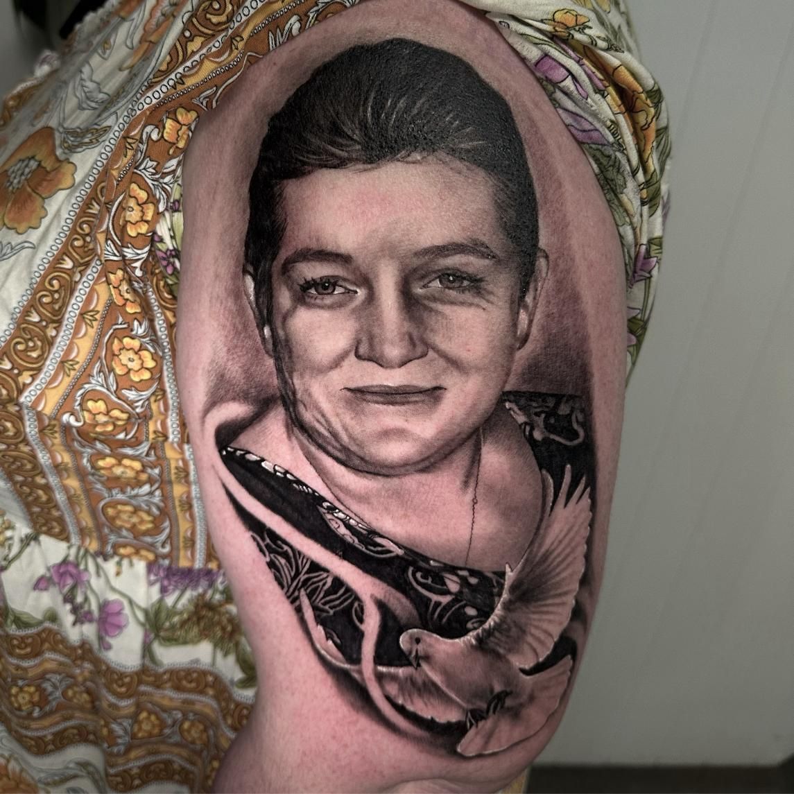 A Man Has a Tattoo of a Motorcycle on His Back  — Gallery Tattoo in Medowie, NSW