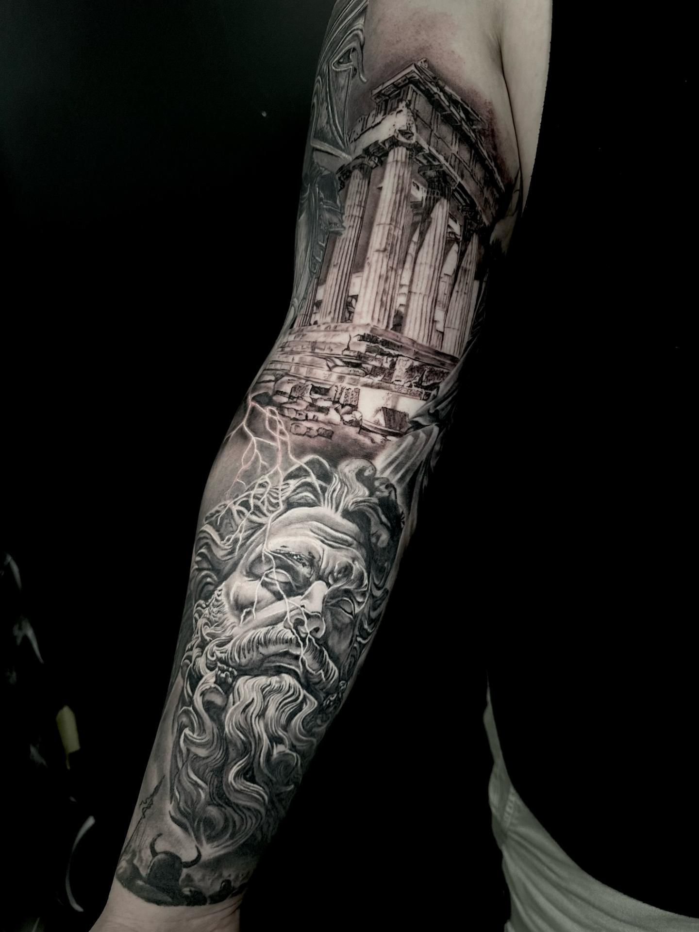 A Black and White Tattoo of a Statue and a Building on a Man 's Arm — Gallery Tattoo in Medowie, NSW