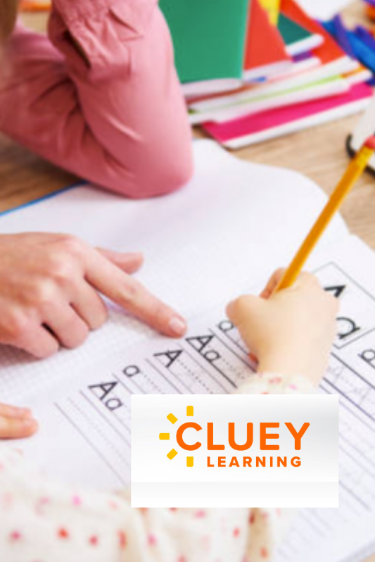 Child practicing writing the letter 