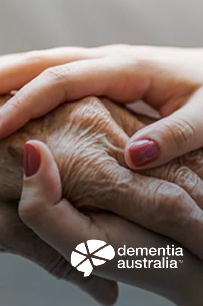 Two hands, one aged and wrinkled, held by a younger hand with red nail polish; Dementia Australia logo.