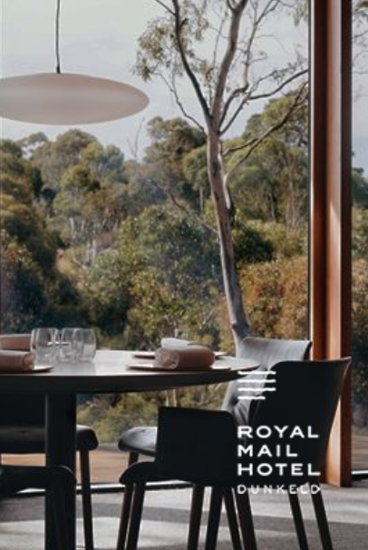 Dining table with chairs by a large window overlooking a forest; Royal Mail Hotel Dunkeld logo.