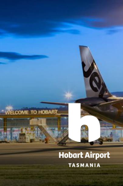 Jetstar plane at Hobart Airport, Tasmania, at dusk. 