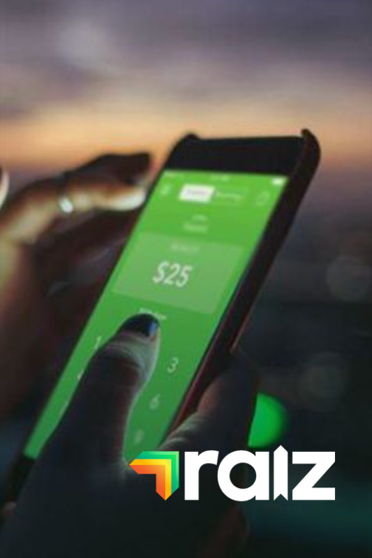Person using a phone with a green interface displaying $25. Raiz logo in the foreground.