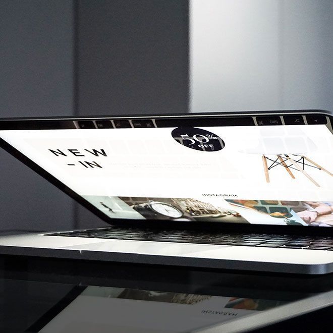 Laptop displaying a website with 