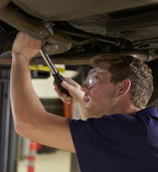 Mechanic Repairs the Car Exhaust System — Elmira, NY — Steve's American Lifetime Muffler