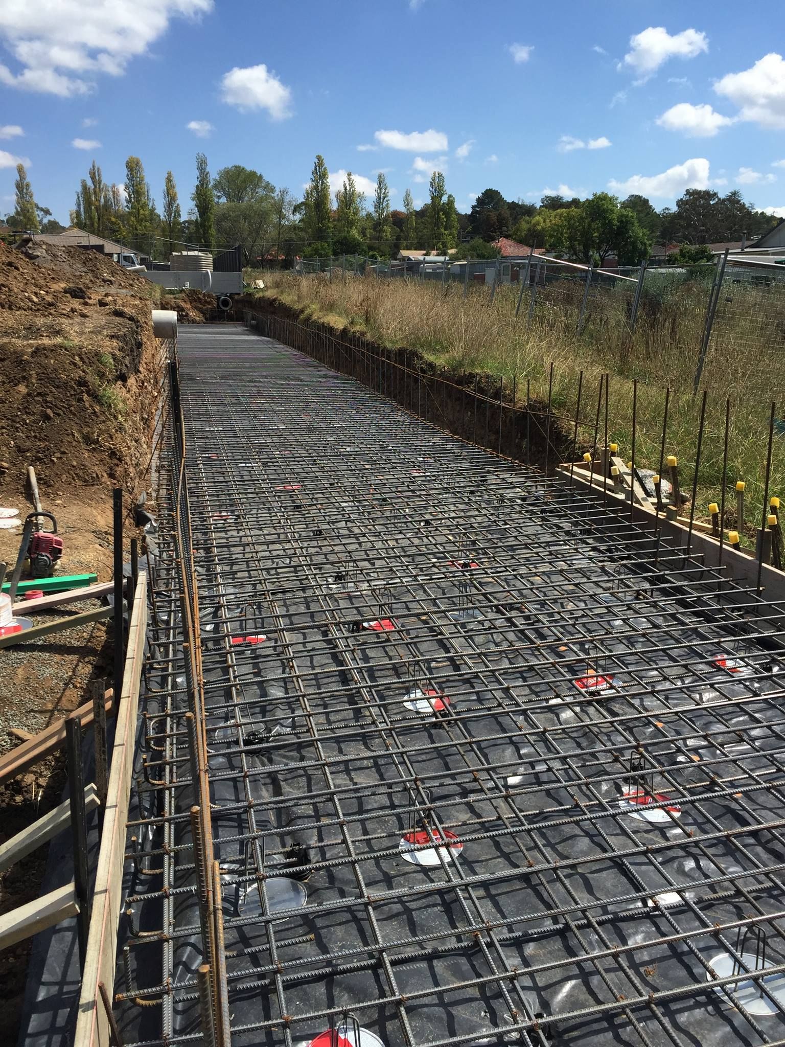 Construction Site With Exposed Rebar Grid — Heritage Concrete In Uralla, NSW
