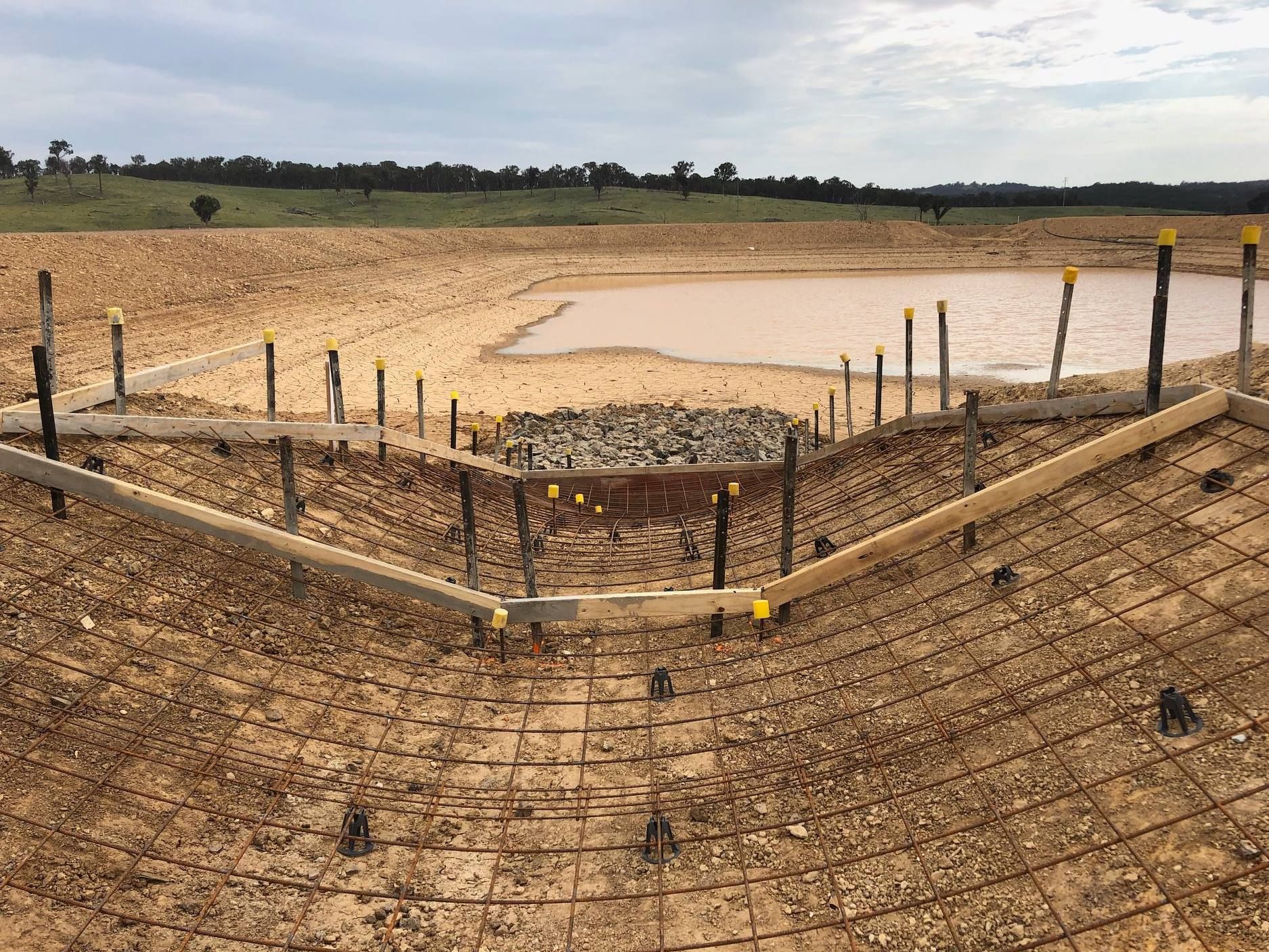 Construction Site Near a Body of Water — Heritage Concrete In Uralla, NSW
