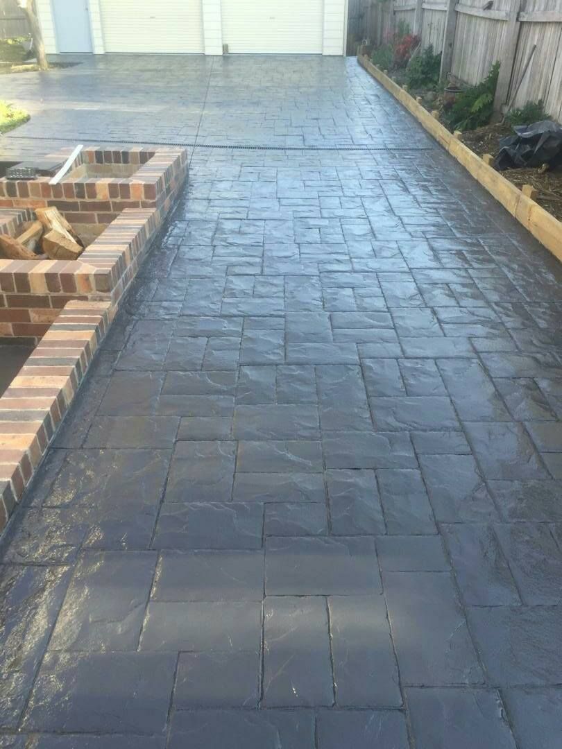 Dark Grey Stamped Concrete Driveway — Heritage Concrete In Uralla, NSW