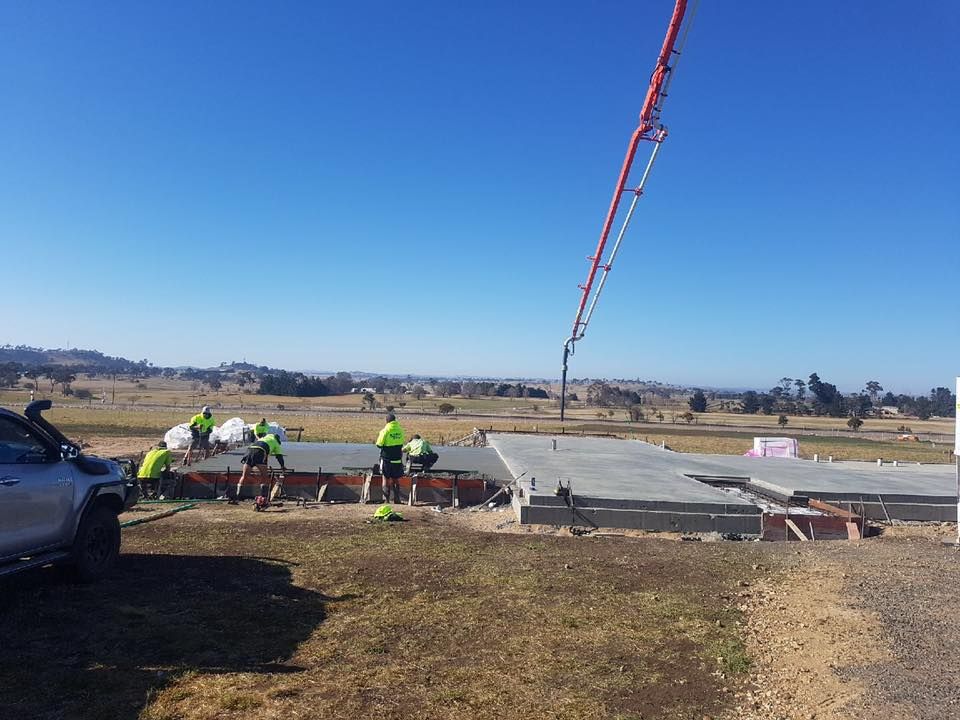 Construction Workers Pouring Concrete — Heritage Concrete In Uralla, NSW