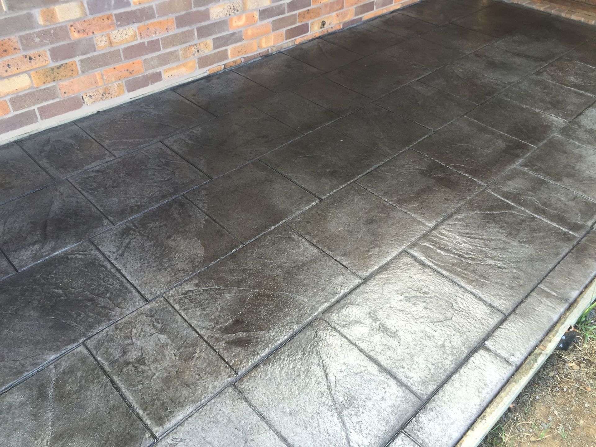 Dark Gray Stamped Concrete Patio — Heritage Concrete In Uralla, NSW