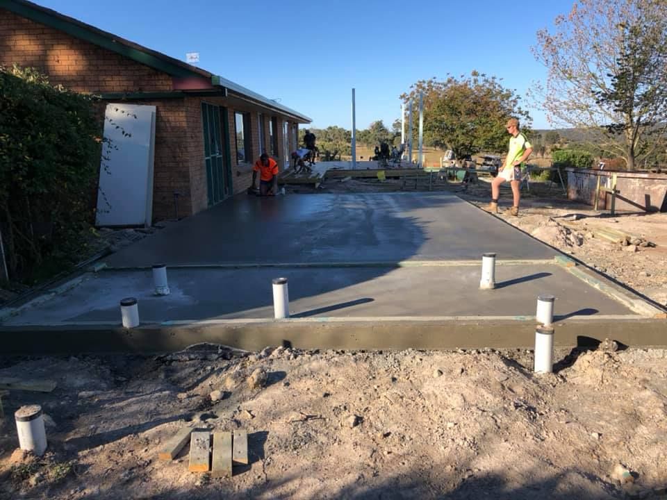 Freshly Poured Concrete Slab With PVC Pipes — Heritage Concrete In Bendemeer, NSW