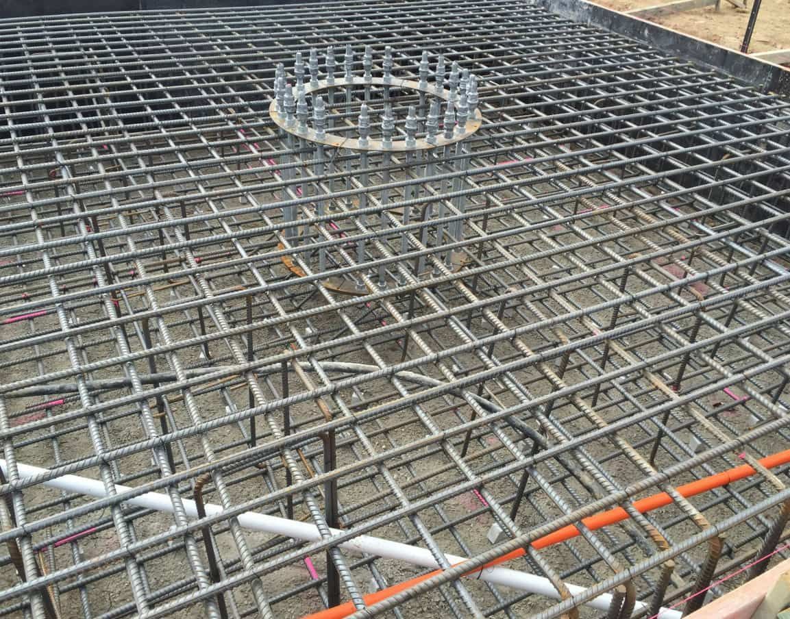 A Close Up Of A Concrete Foundation With A Circular Hole In The Middle — Heritage Concrete In Uralla, NSW