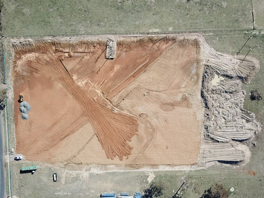 An Aerial View Of A Large Pile Of Dirt In A Field — Heritage Concrete In Uralla, NSW