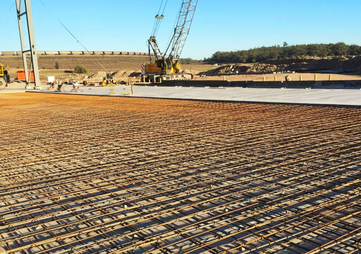 A Construction Site With A Crane In The Background — Heritage Concrete In Uralla, NSW