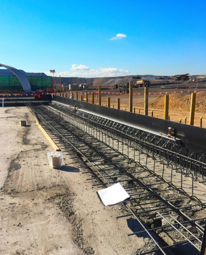 A Concrete Structure Is Being Built On A Dirt Road — Heritage Concrete In Uralla, NSW