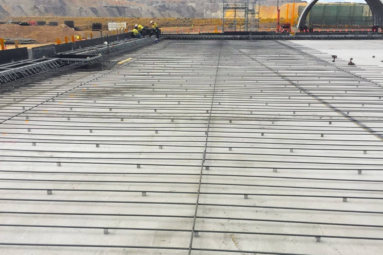 A Concrete Floor Is Being Built On A Construction Site — Heritage Concrete In Uralla, NSW