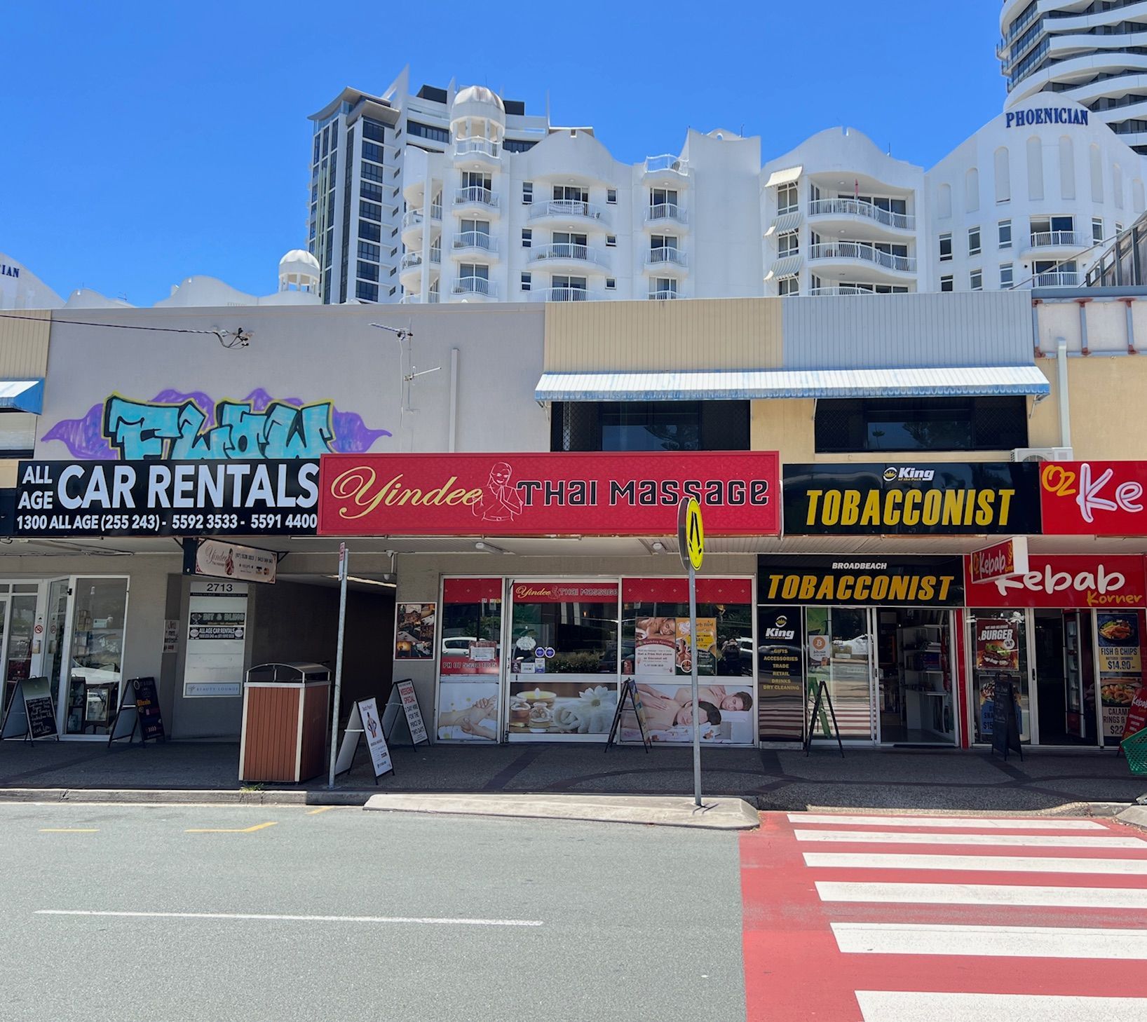 Street shops with various signs, including 