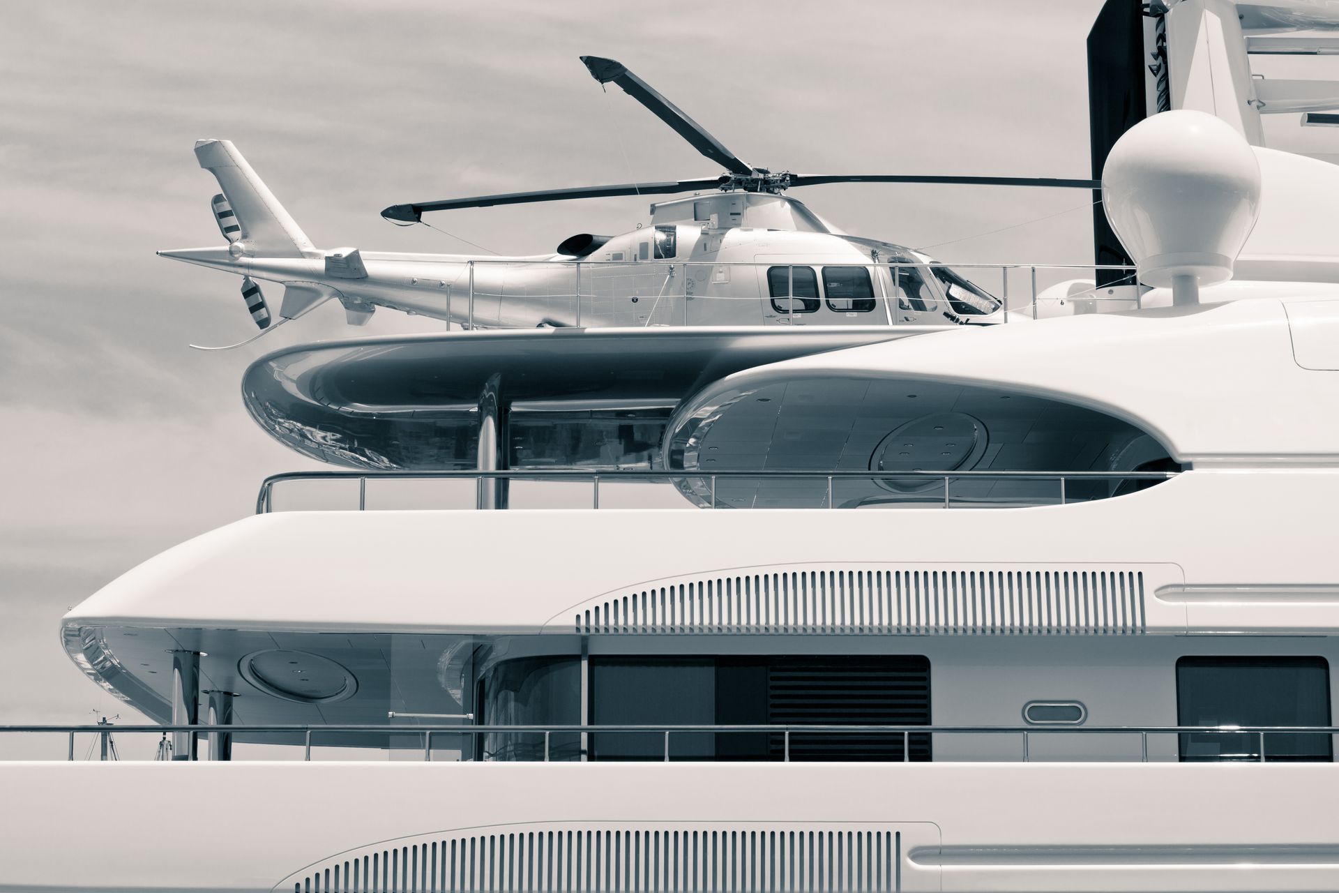 A helicopter landing on a superyacht heliport