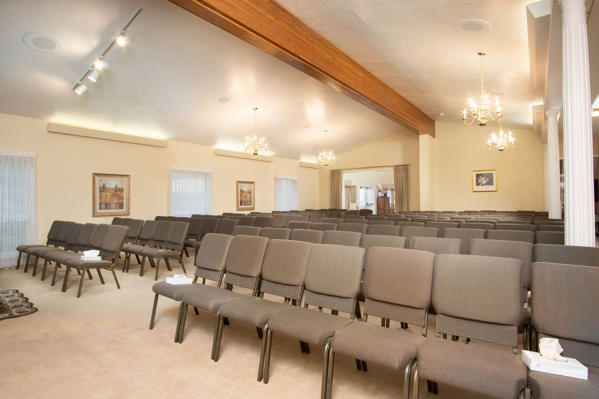 A large room with rows of chairs and tables
