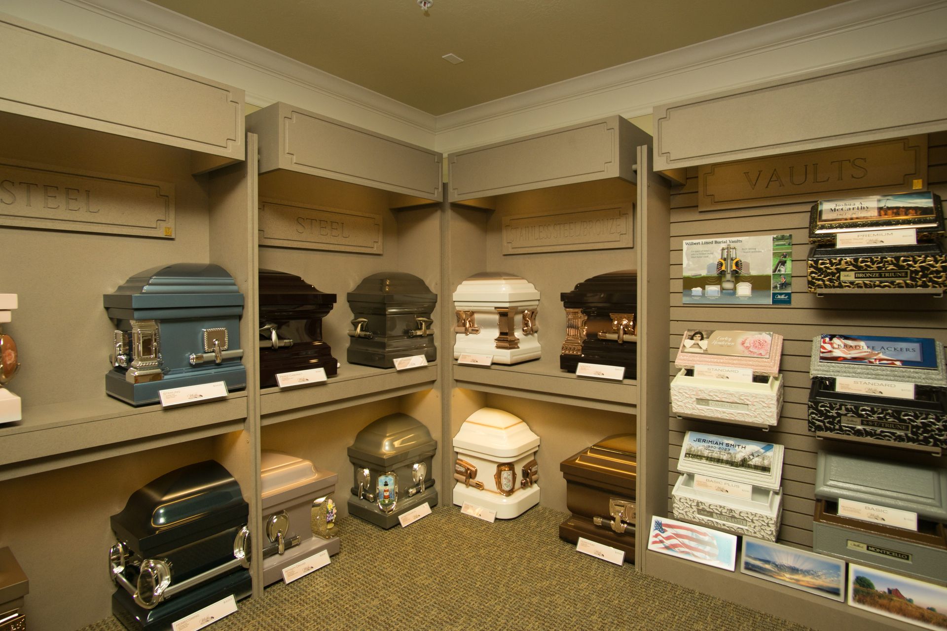 There are many different types of coffins on display in this room.