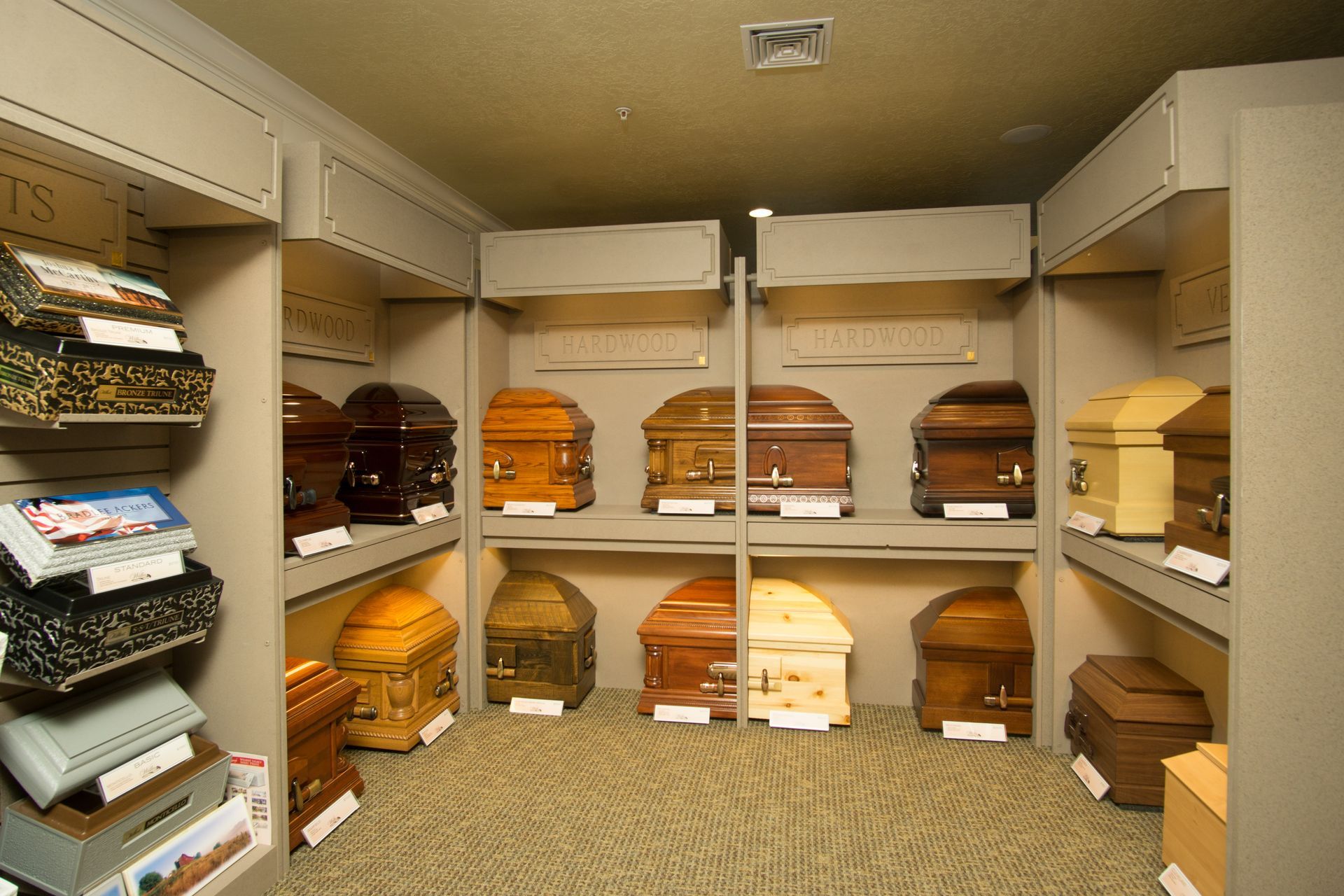 A room filled with many different types of coffins