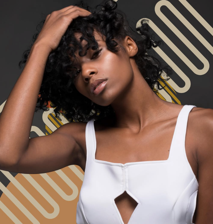 A person in a white top poses with a hand to their hair against a black background with gold, rounded graphic lines.