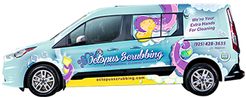 A light blue Octopus Scrubbing van with cleaning graphics and a phone number on the side.