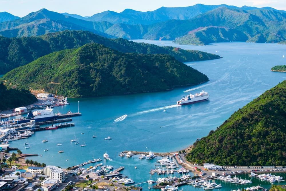 An Aerial View Of A Large Body Of Water Surrounded By Mountains — Brown's Vegetation Management In Marlborough, QLD