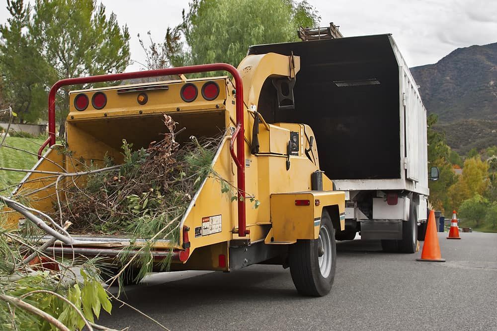 A Tree Chipper Is Attached To The Back Of A Truck — Brown's Vegetation Management In Mulara, QLD