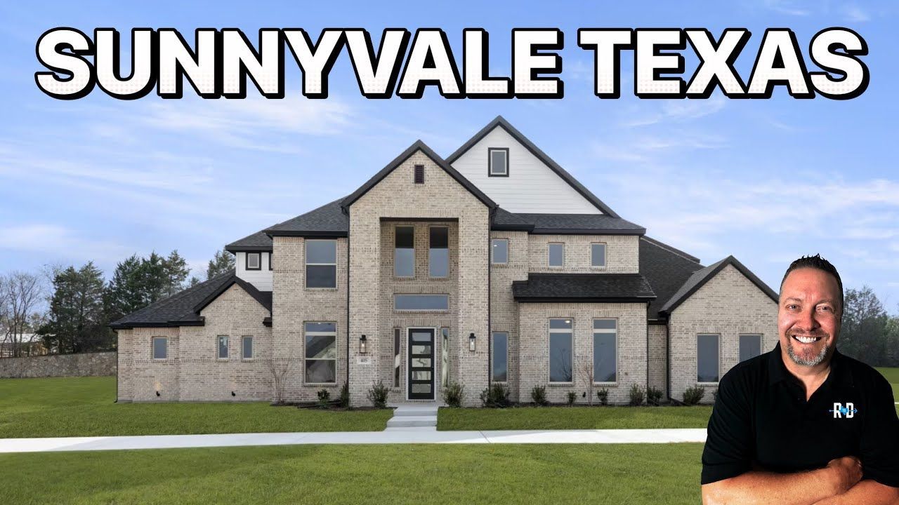 A man smiling in front of a large brick house in Sunnyvale, Texas.