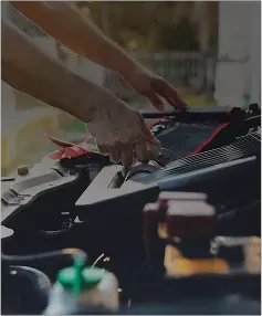 Man repairing engine of vehicle | Foltz Automotive