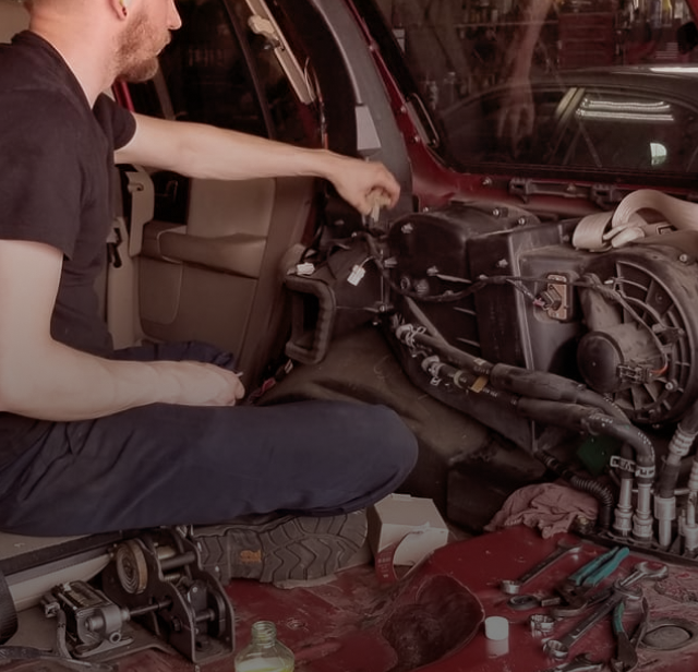 Technician working on vehicle | Foltz Automotive