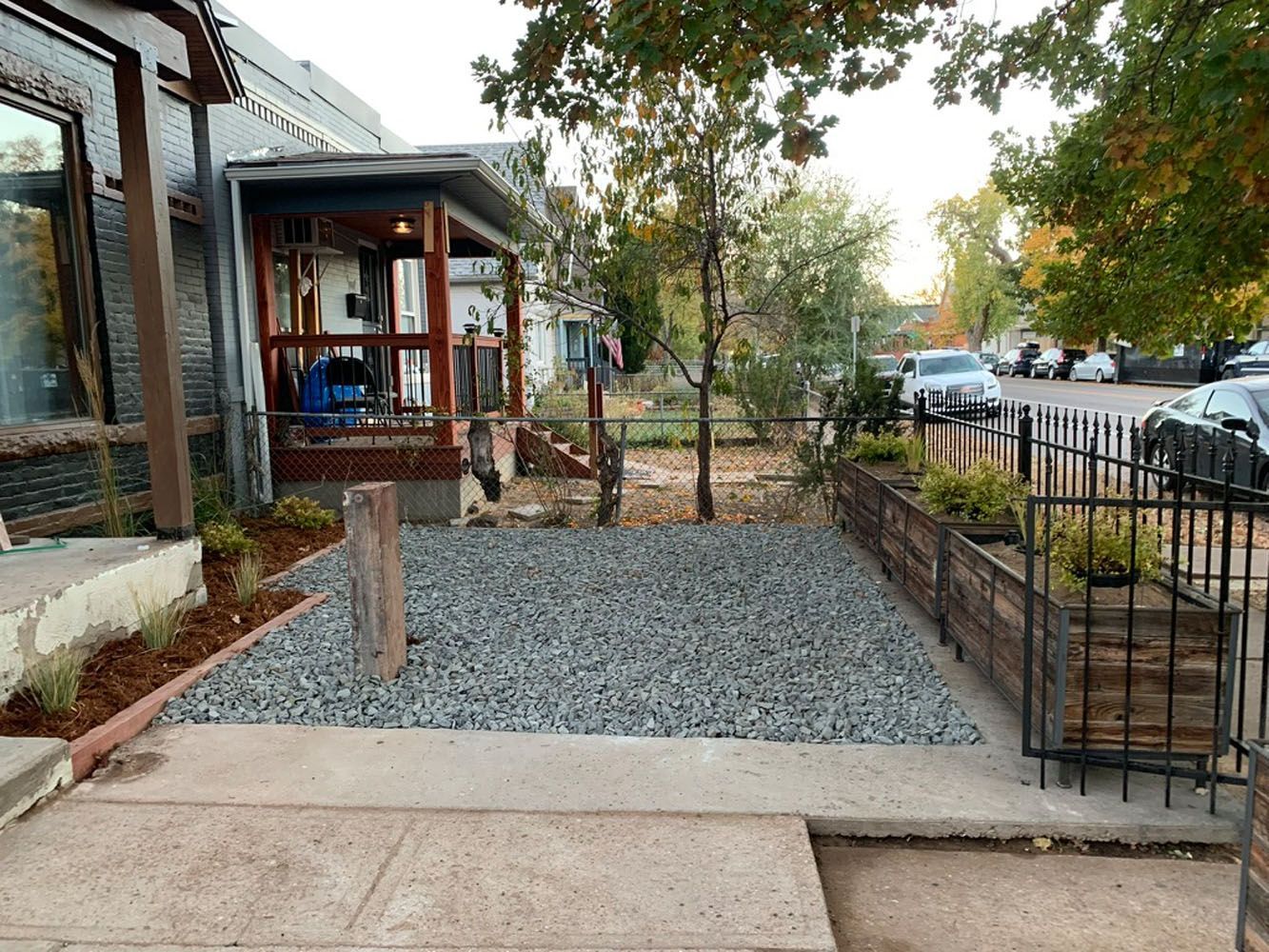 A gravel path leading to a house with a porch. HGTV