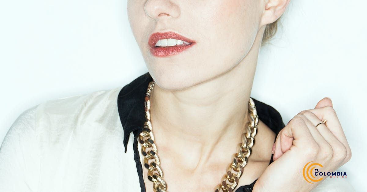 A woman wearing a gold chain around her neck