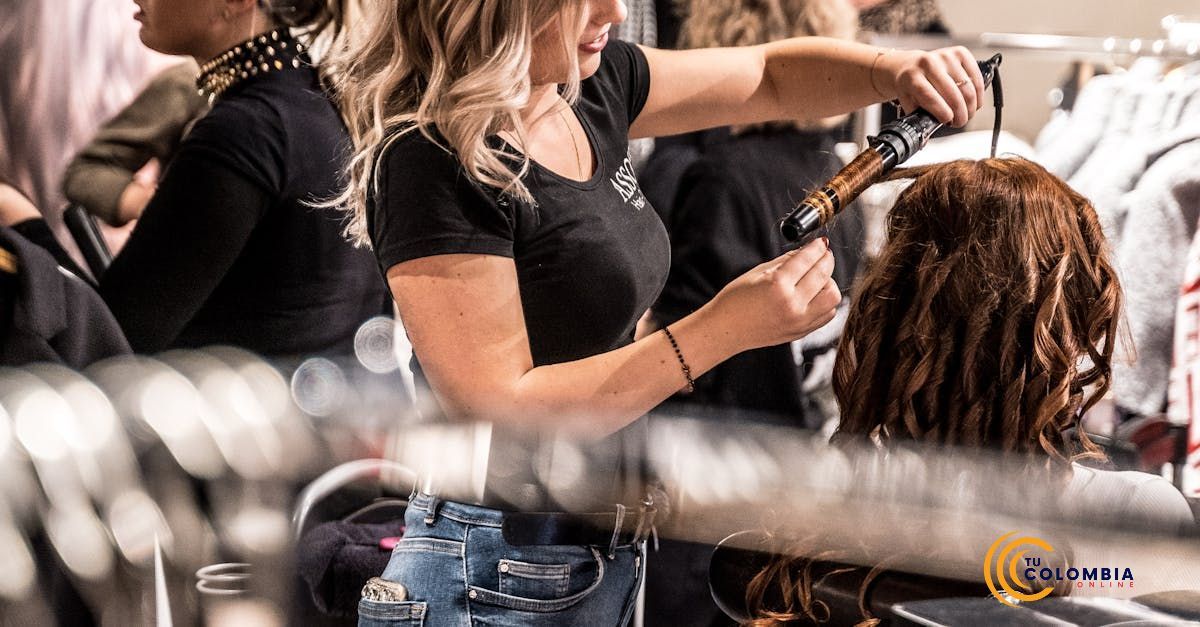 A woman is styling a mannequin 's hair in a salon.