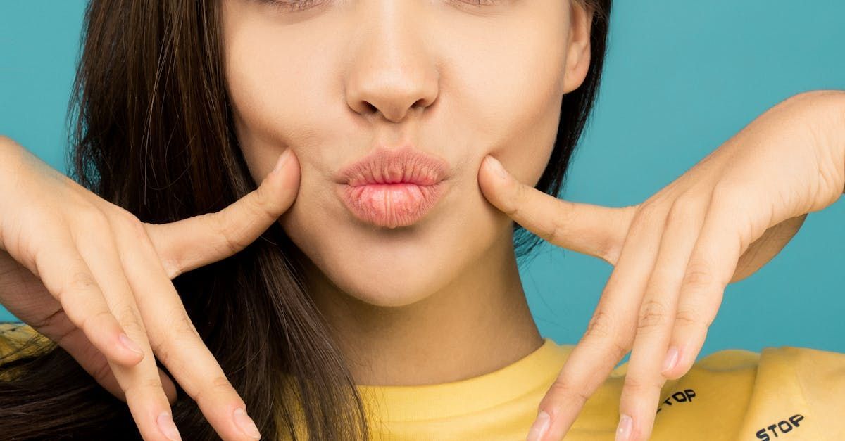 A woman is making a funny face with her hands.