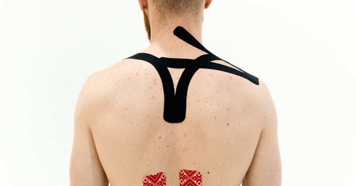 A man with lidocaine patch on his back and neck.