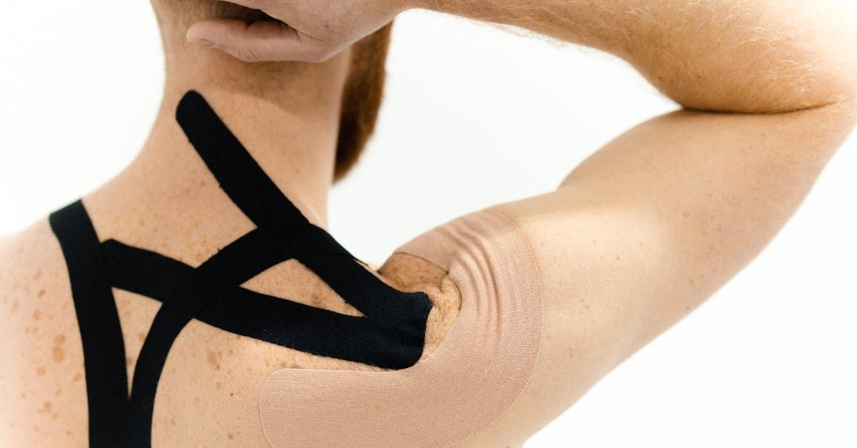 A woman has lidocaine tape on her neck and shoulder