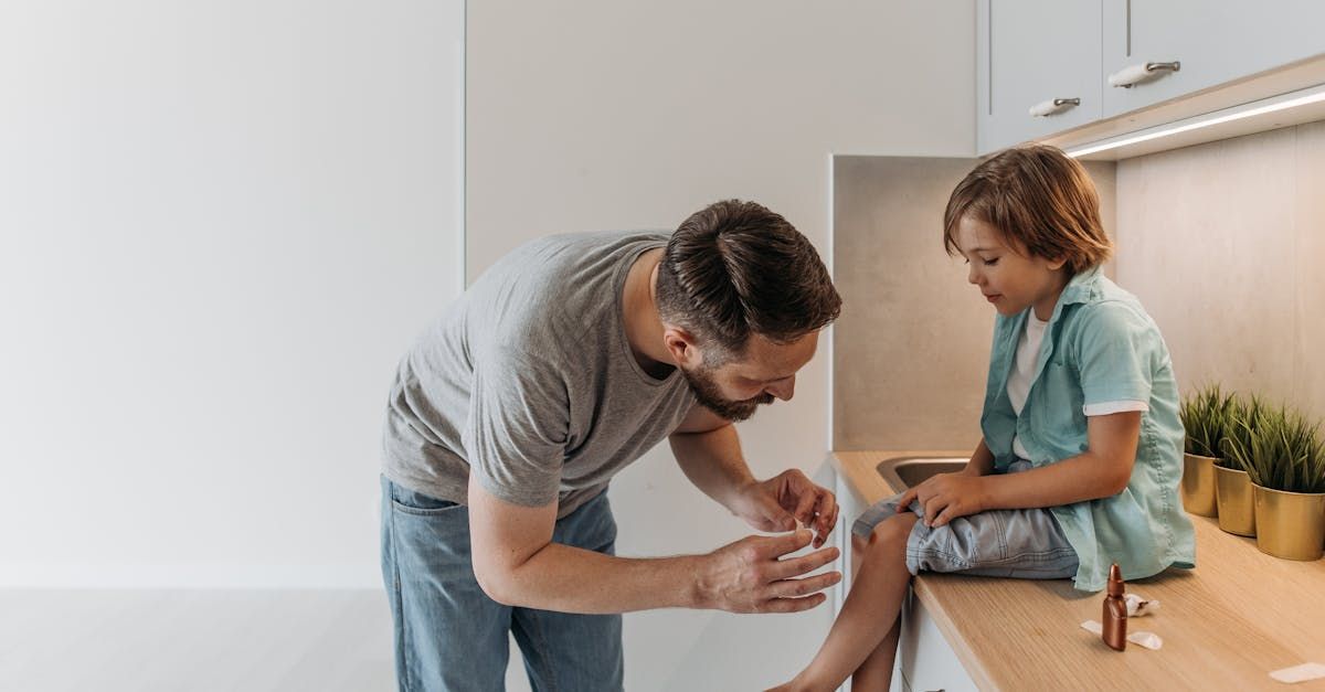 Father helping to cure wound.