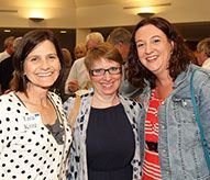 Three women are posing for a picture together