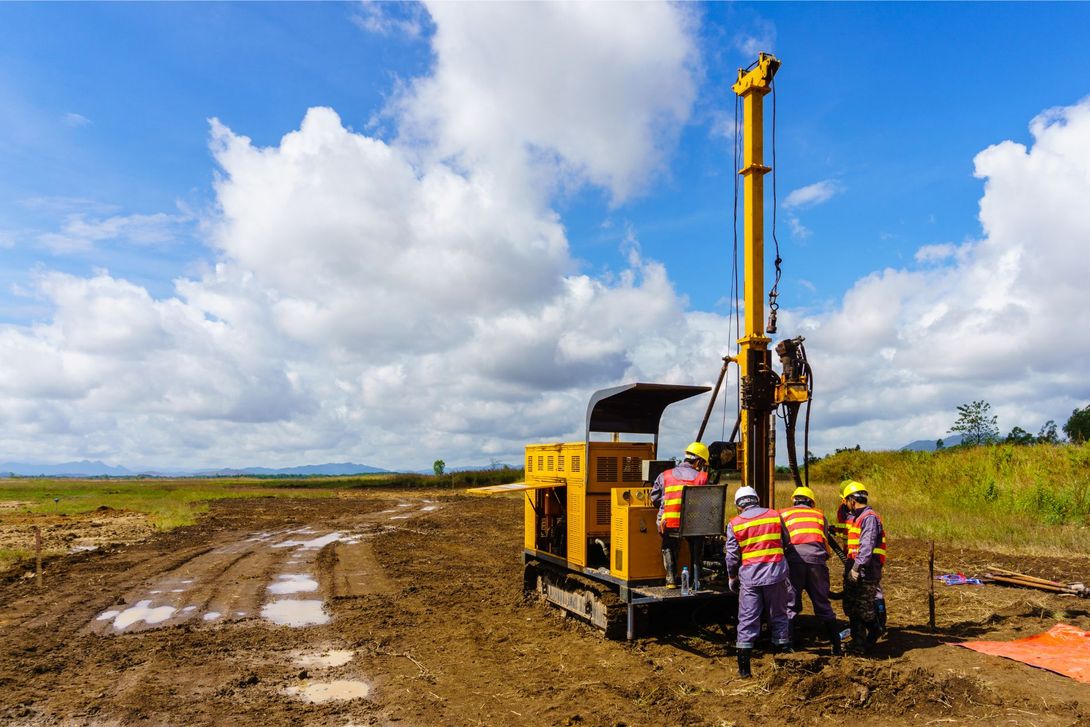 workers carry out geotechnical surveys