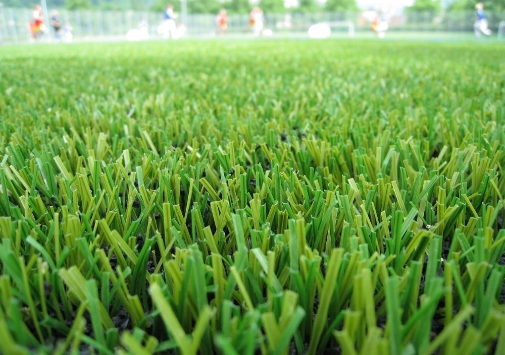 lady laying on the fake grass in Sheffield