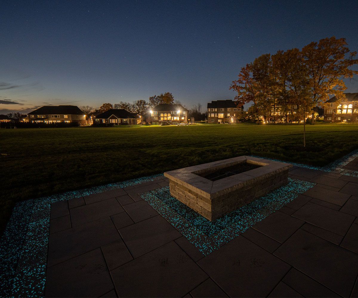 Ohio backyard patio with glow in the dark paving stones and fire pit.